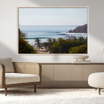 View of calm ocean waves with palm trees and a tropical coastline, ideal for coastal boho or beach-themed wall decor.
