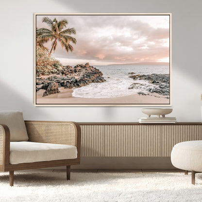 A peaceful beach scene with a palm tree and rocks, soft waves washing onto the shore under a soft pastel sky at sunset.