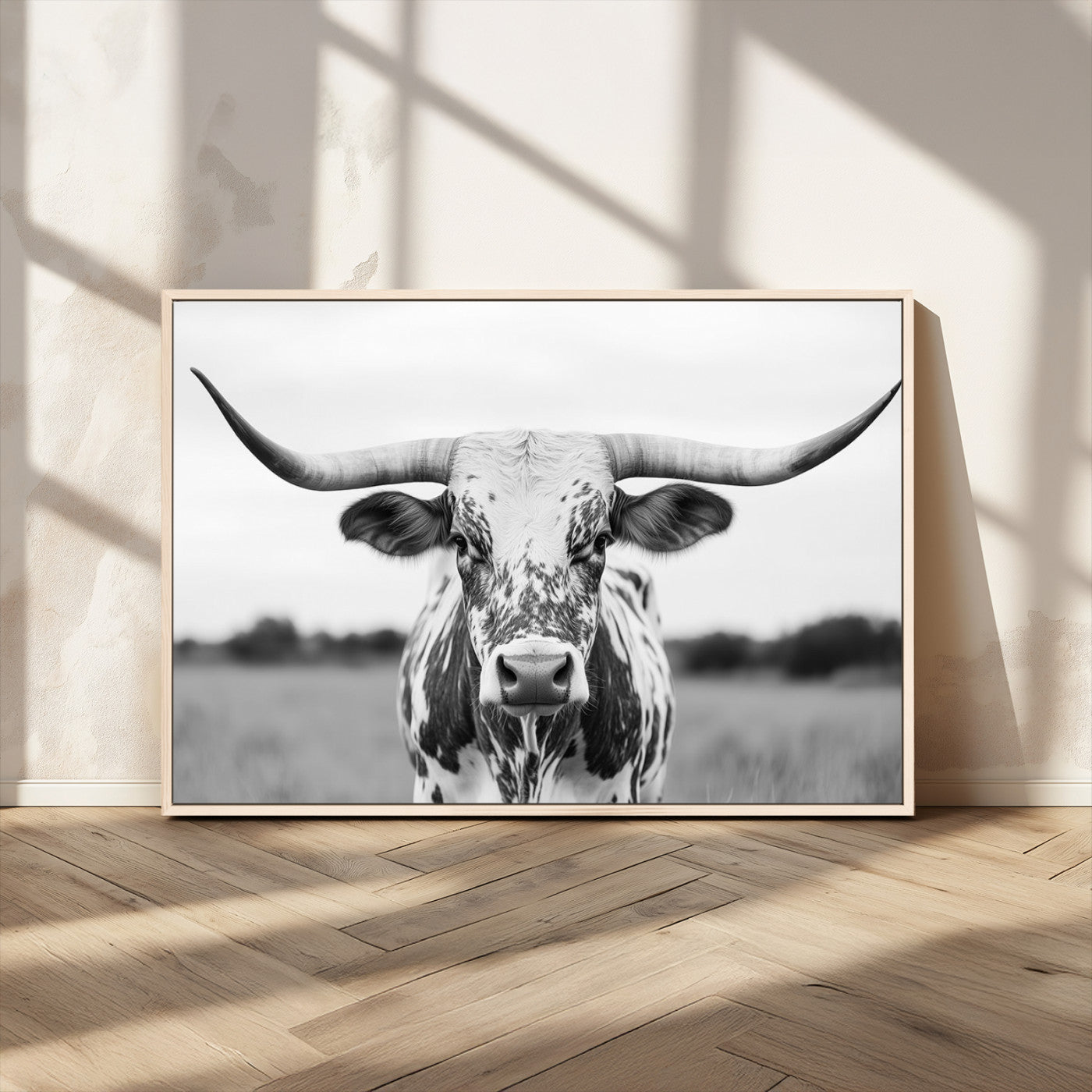 Capture the strength and elegance of nature with this striking black and white portrait of a longhorn cow. Its powerful presence makes a bold statement in any room.