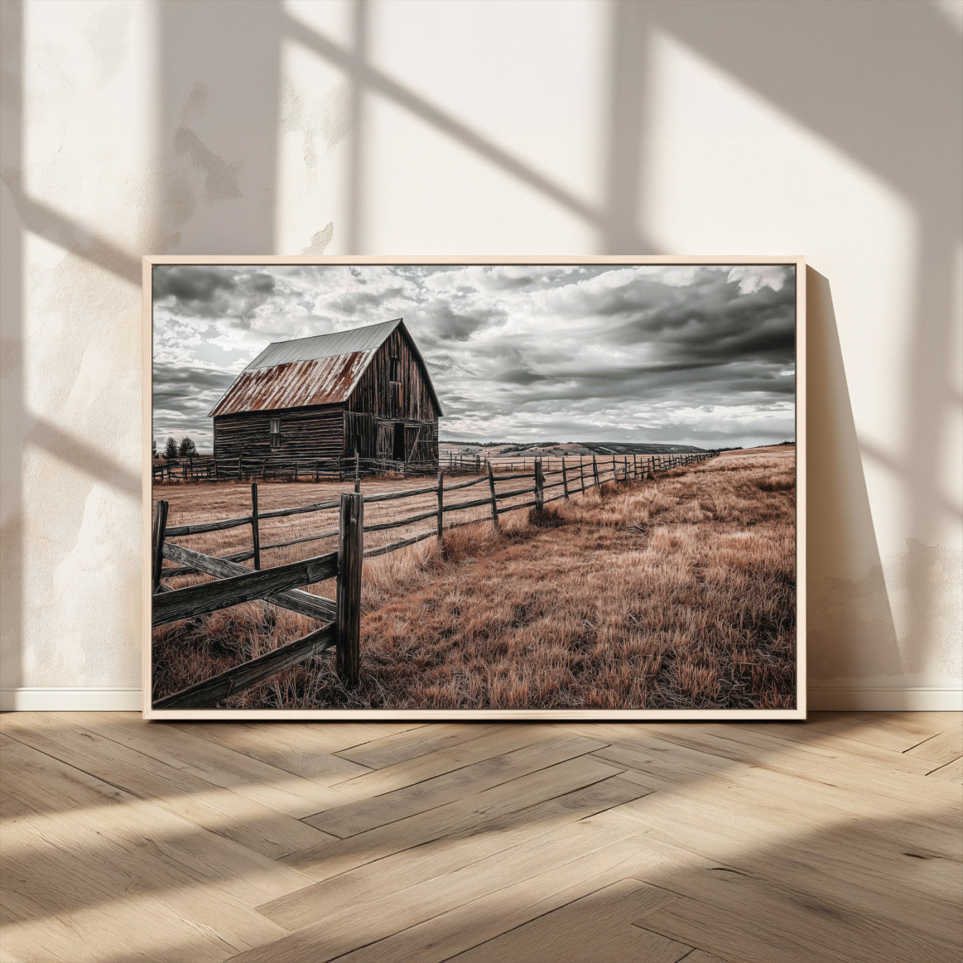 Framed canvas of a rustic barn under a moody sky with weathered fence and dark fields, ideal for farmhouse or rural-style wall decor.