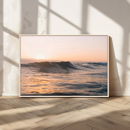 Framed canvas of ocean waves glowing in sunset light, ideal for golden hour calm or peaceful coastal-inspired wall decor.