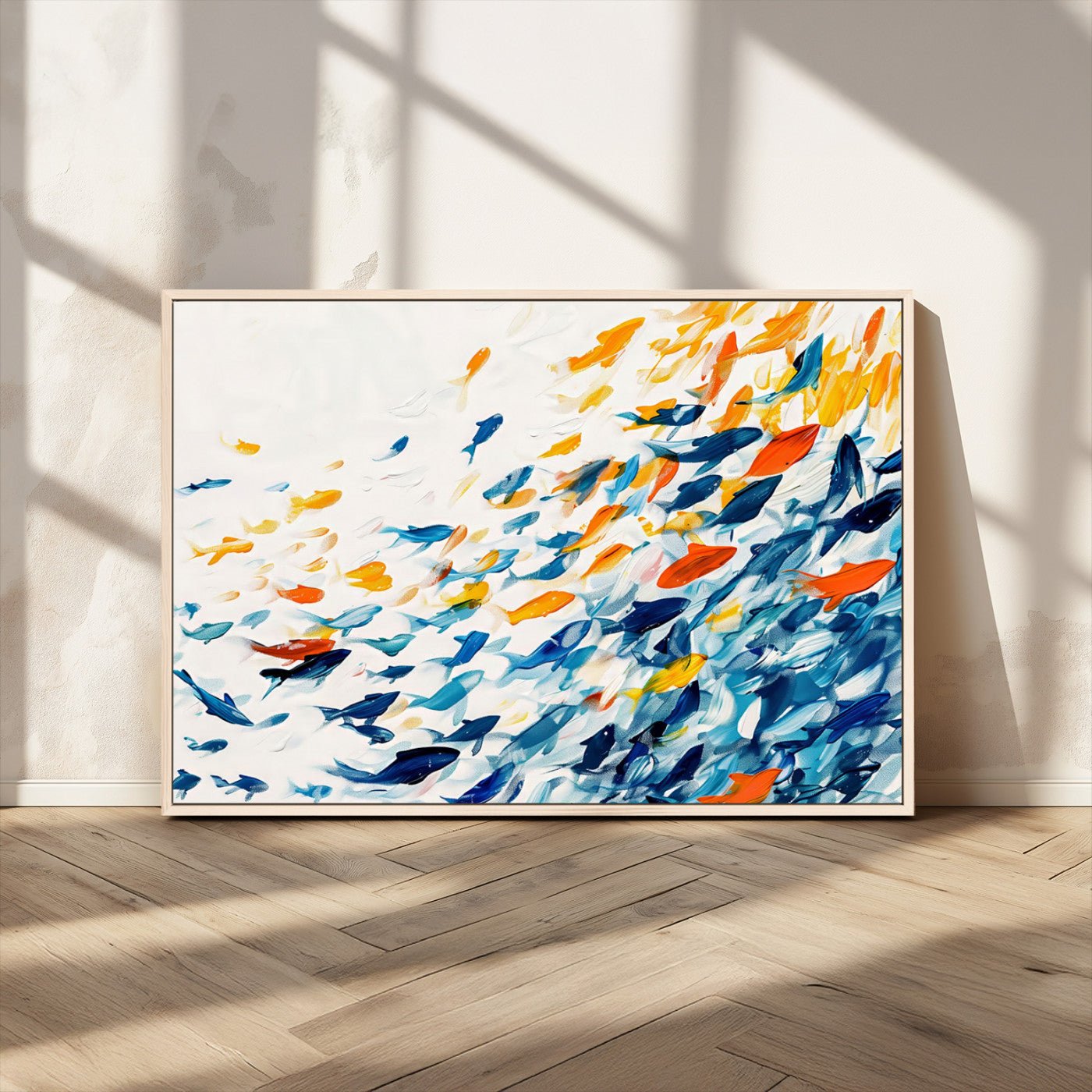 A modern abstract canvas featuring a dynamic school of colorful fish in blue, orange, and yellow tones, ideal for coastal or contemporary decor.