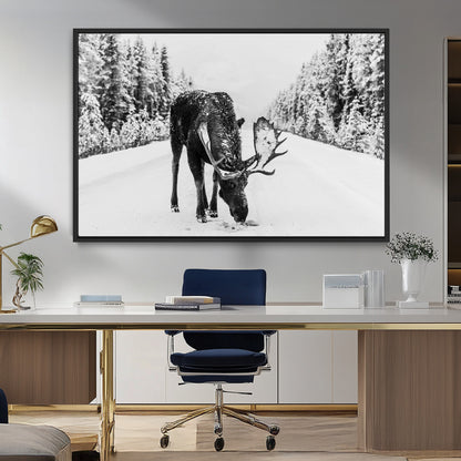 A majestic moose grazing in the snow-covered wilderness, surrounded by snow-covered trees, creating a peaceful winter scene.