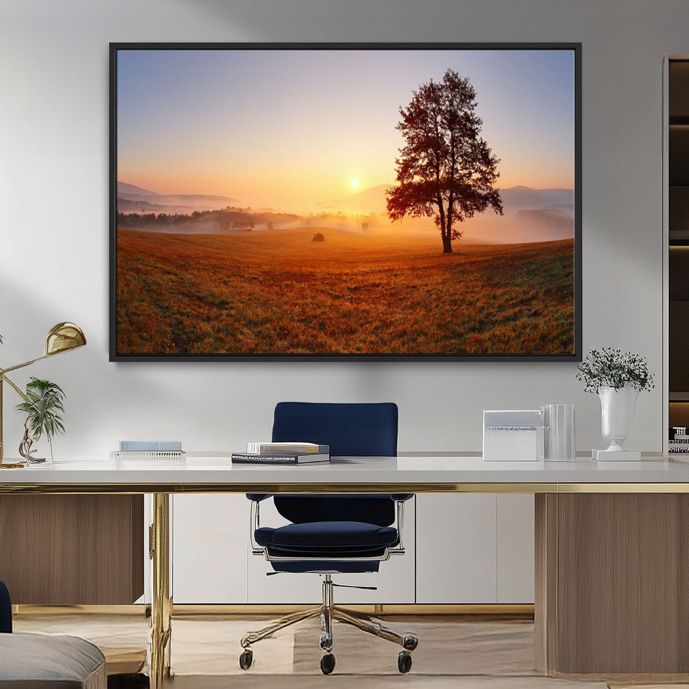 A tranquil landscape at sunrise with a mist-covered field and a lone tree, creating a peaceful and natural atmosphere.