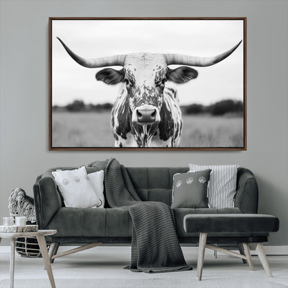 Capture the strength and elegance of nature with this striking black and white portrait of a longhorn cow. Its powerful presence makes a bold statement in any room.