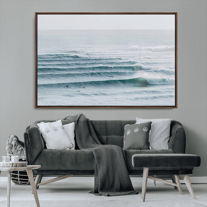 High-angle view of surfers lining up across layered ocean waves, ideal for minimal coastal or surf-inspired room decor.