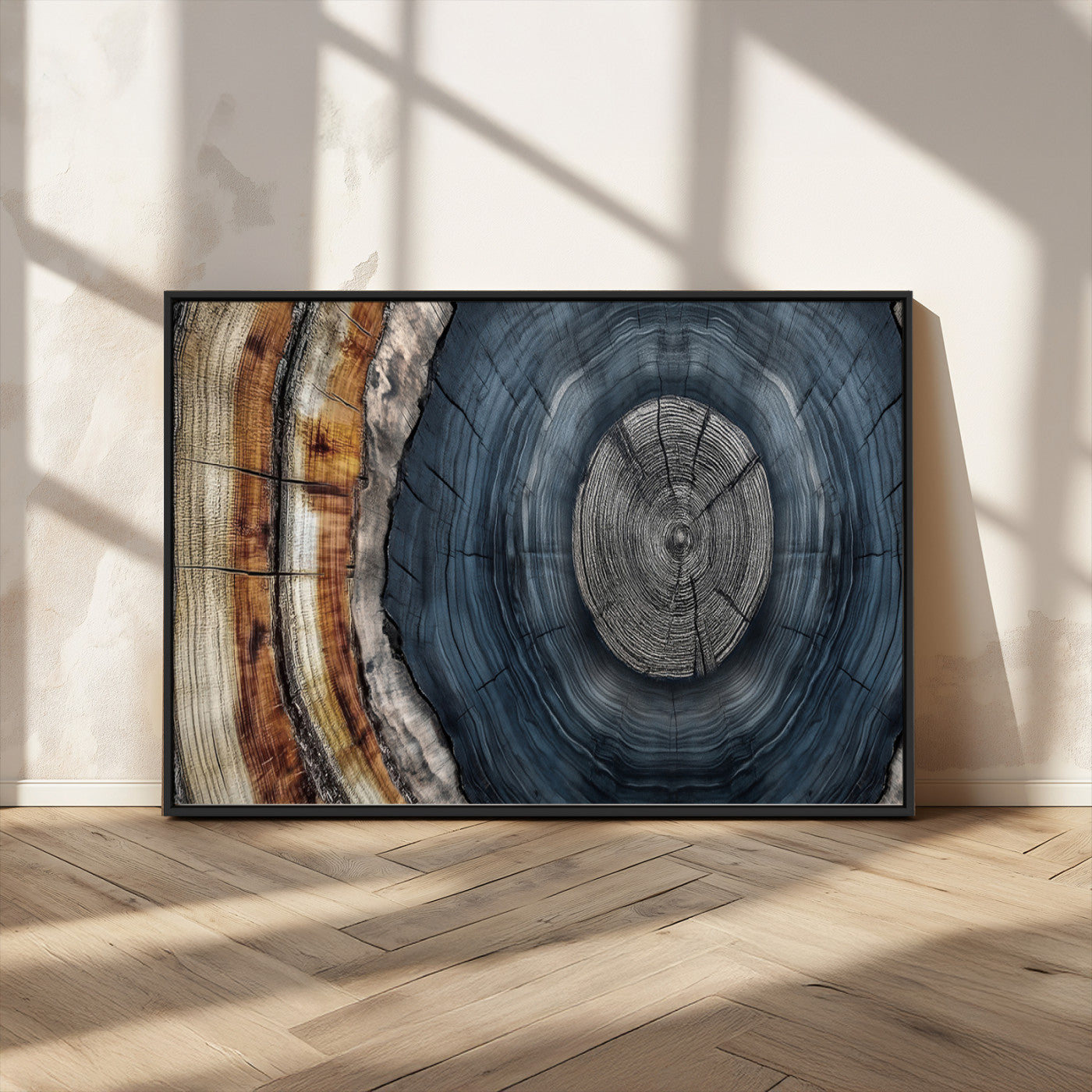A stunning close-up of a tree trunk showing the intricate, circular growth rings, showcasing the natural textures and rich contrasts in deep blues, browns, and silvers.