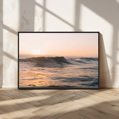 Framed canvas of ocean waves glowing in sunset light, ideal for golden hour calm or peaceful coastal-inspired wall decor.
