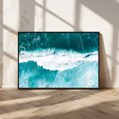 Aerial view of turquoise ocean waves crashing with white foam, perfect for tropical coastal or modern beach-style home decor.