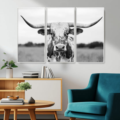 Capture the strength and elegance of nature with this striking black and white portrait of a longhorn cow. Its powerful presence makes a bold statement in any room.