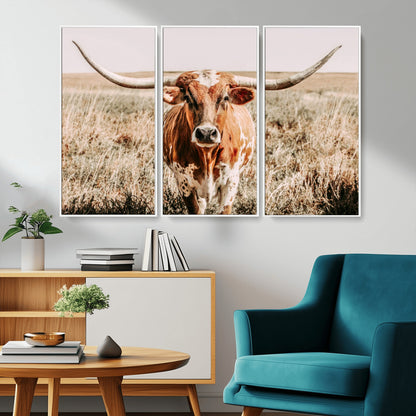 Framed longhorn cow canvas wall art with rustic prairie background, western animal print perfect for farmhouse or ranch style decor