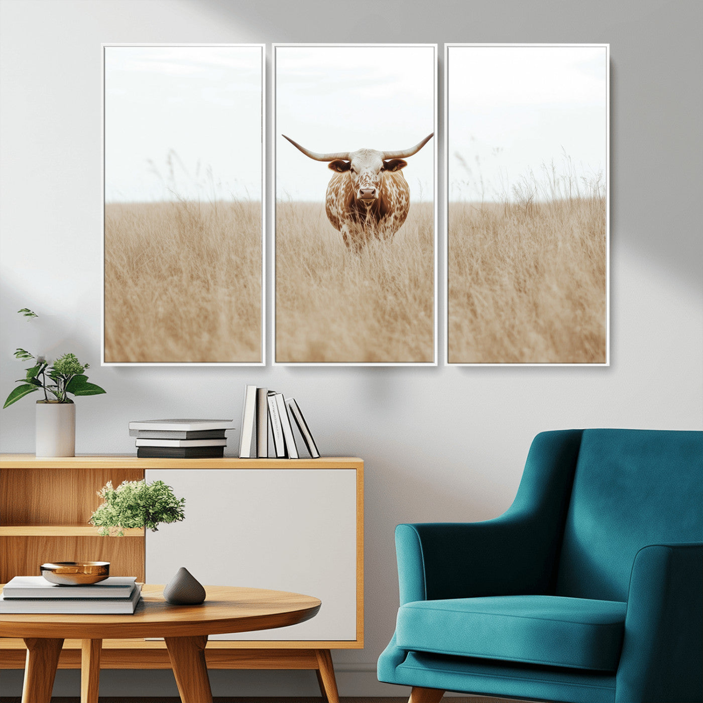 Texas Longhorn bull standing alone in dry grass with neutral tones, ideal for rustic western or cowboy-themed wall decor.