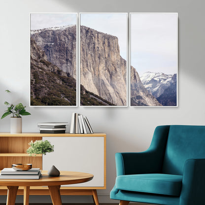 Framed canvas of El Capitan’s vertical granite face in Yosemite with snowy peaks, ideal for Sierra minimalism or mountain-inspired decor.