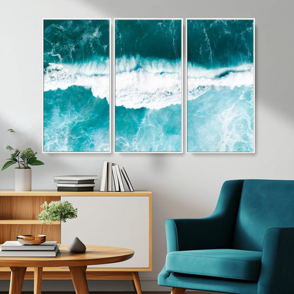 Aerial view of turquoise ocean waves crashing with white foam, perfect for tropical coastal or modern beach-style home decor.