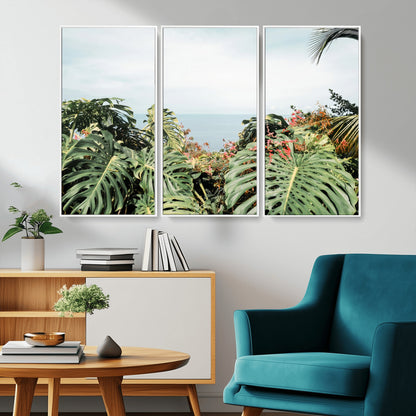 Monstera leaves and tropical flowers framing a calm ocean view, ideal for tropical coastal or exotic jungle-style interior wall decor.