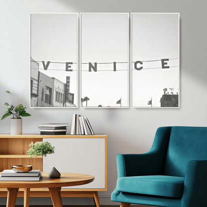 Black and white photo of Venice Beach sign and palm-lined street, perfect for urban coastal or minimalist LA-inspired wall decoration.