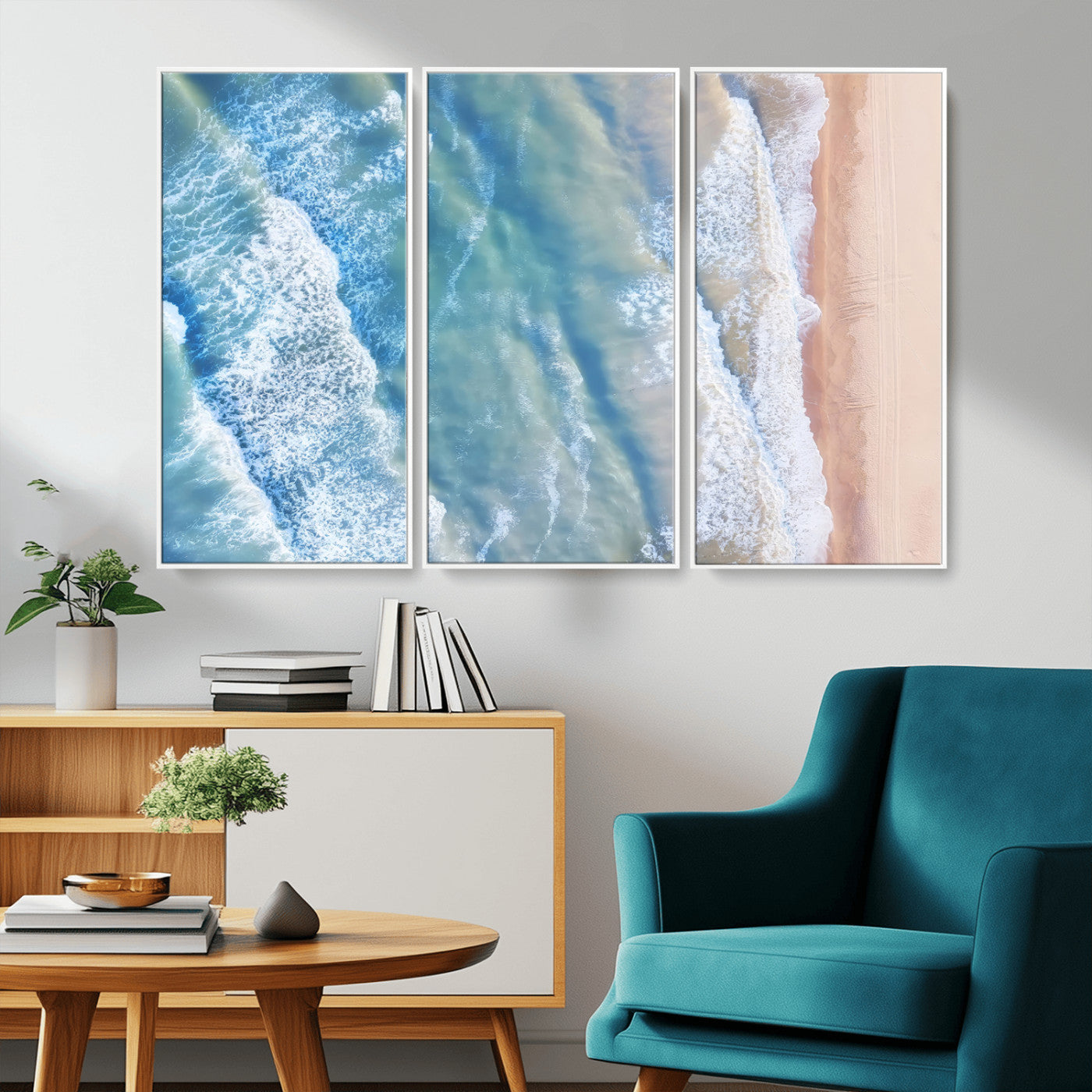 Aerial photo of soft blue waves meeting sandy shore, perfect for modern coastal or beach-themed decor with a light and tranquil aesthetic.