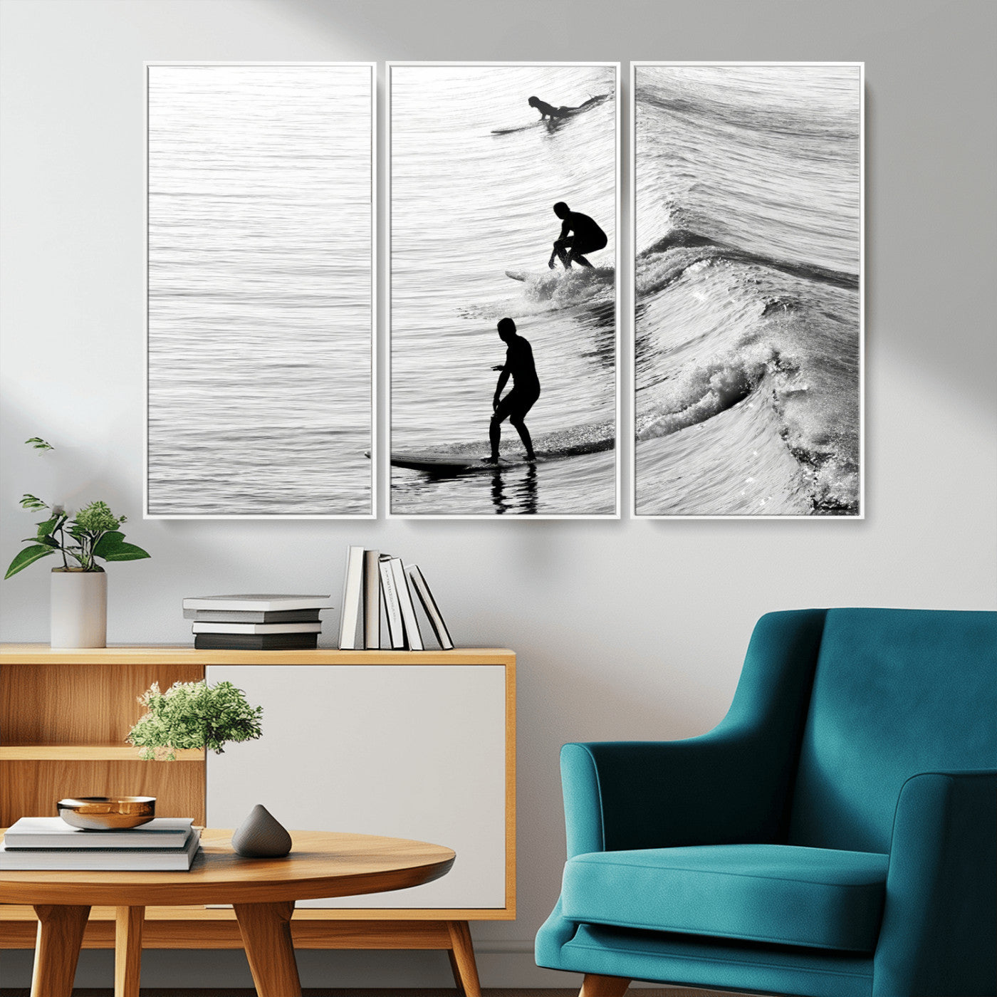 Black and white photo of surfers riding waves in a moody, high-contrast scene, ideal for modern coastal or surf-inspired home decor.