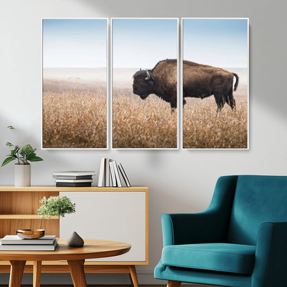 A majestic bison standing in an open prairie field, its strong form blending into the golden grass under a vast blue sky, evoking the wild spirit of the American plains.