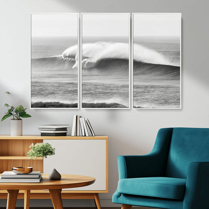 A dramatic black and white ocean wave crashing with immense force, capturing the raw power and movement of the sea in a bold seascape.