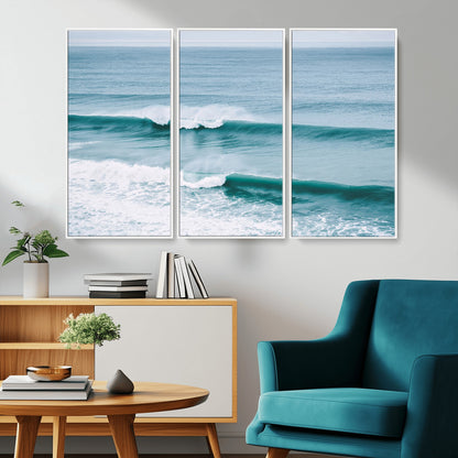 Powerful ocean waves rolling towards the shore, their turquoise hues blending with white sea foam under an open horizon, capturing the essence of the ocean's movement.