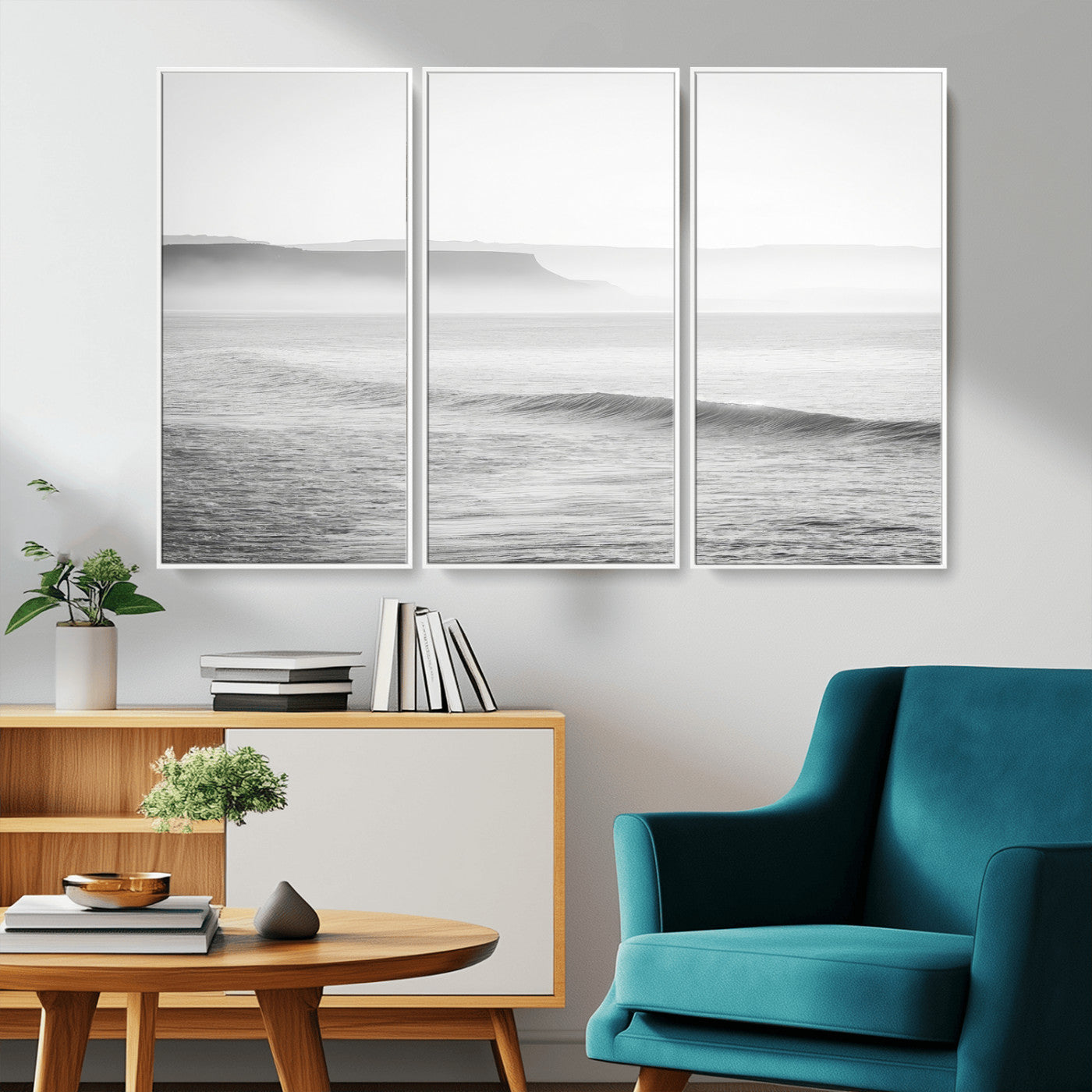 A black and white minimalist seascape featuring soft rolling waves and misty distant cliffs, creating a serene and timeless coastal atmosphere.