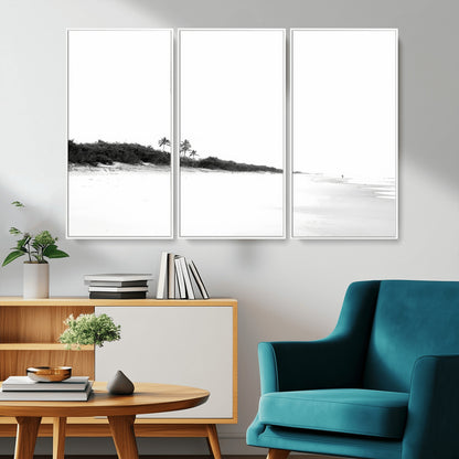A black and white minimalist coastal scene with a vast open beach, distant palm trees, and a lone figure walking along the shoreline, evoking serenity and solitude.