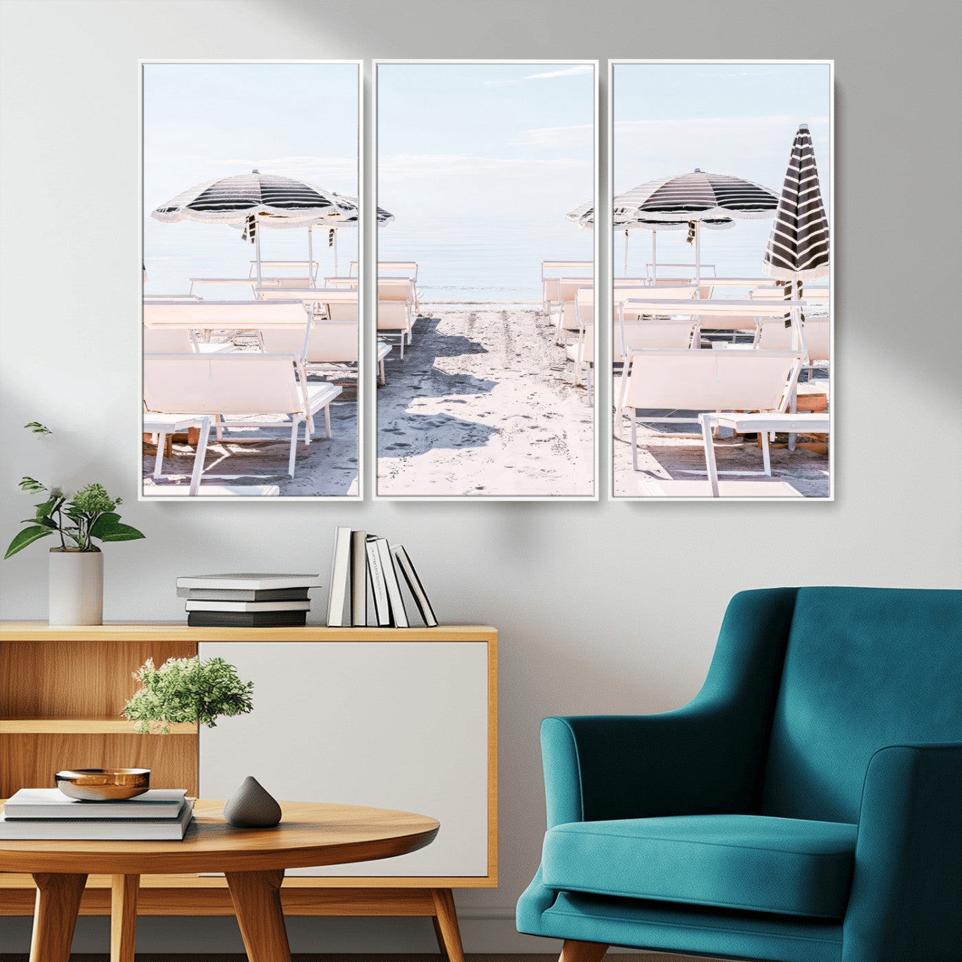A serene minimalist beach scene featuring striped umbrellas, soft pastel sand, and an elegant lounge setup, creating a tranquil and stylish coastal retreat.