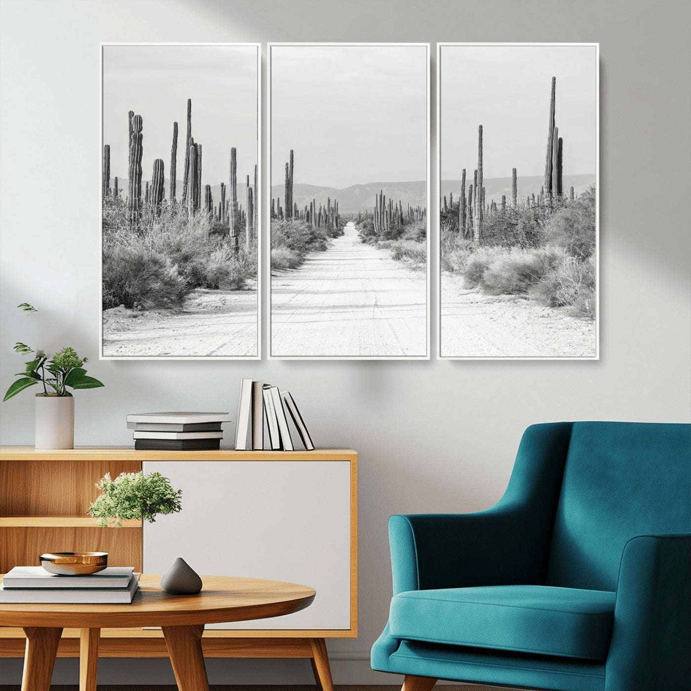 A black and white desert road stretching through a cactus-filled landscape, creating a rugged and timeless southwestern aesthetic with a sense of adventure.