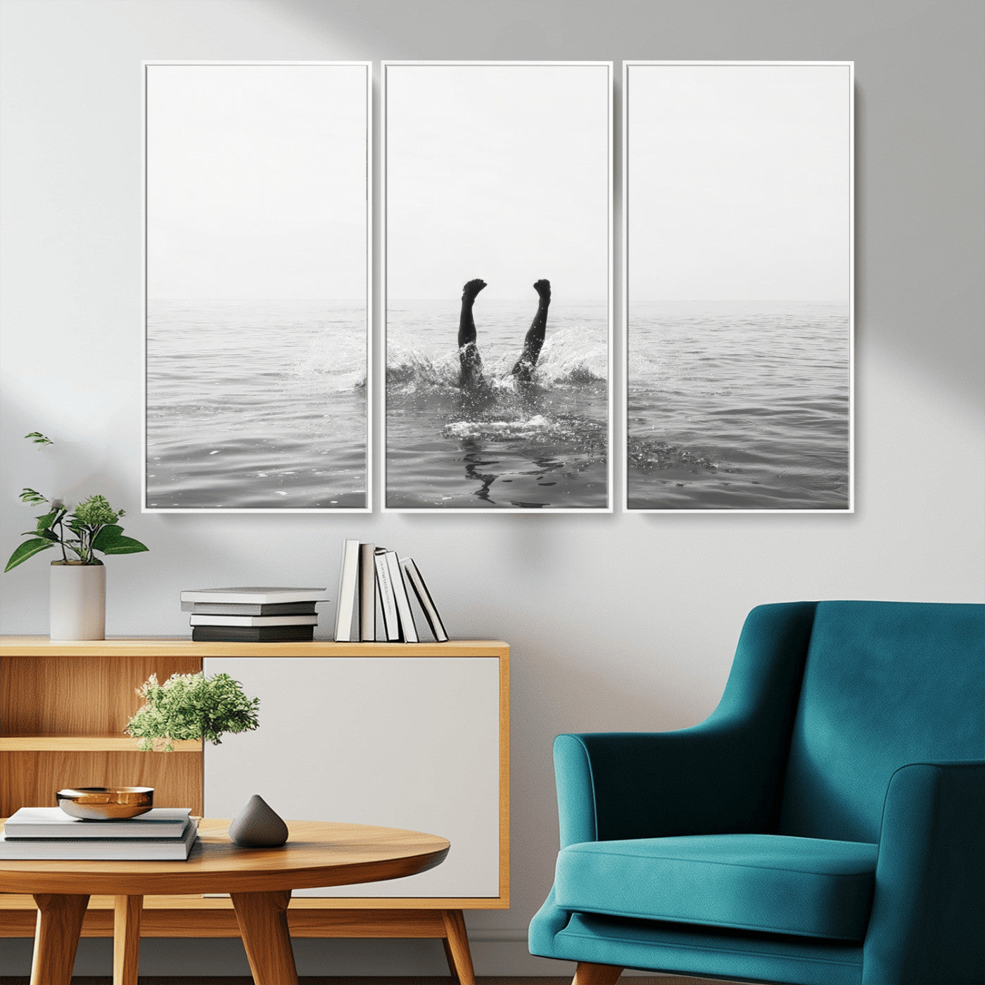 A black and white minimalist water scene capturing a playful splash as a swimmer dives upside down, creating a carefree and artistic aquatic aesthetic.