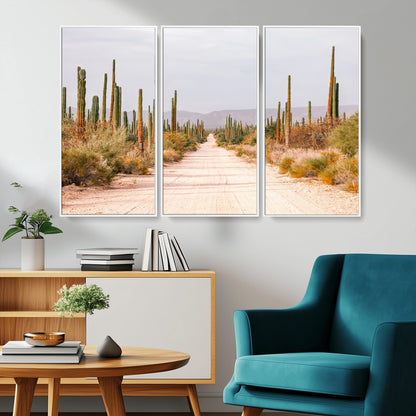 A desert road lined with saguaro cacti under a golden sky, creating a warm southwestern feel, perfect for boho or rustic decor.