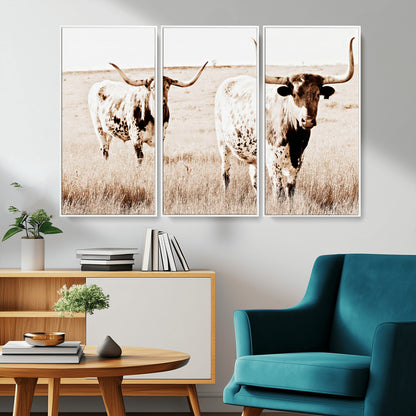 Two Texas longhorn cows standing in a sepia-toned pasture, evoking rustic charm perfect for farmhouse or western country interiors. (
