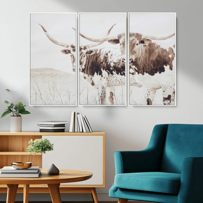 Two longhorn cows standing in a sepia-toned pasture with soft light, ideal for rustic or farmhouse-themed neutral wall decor.