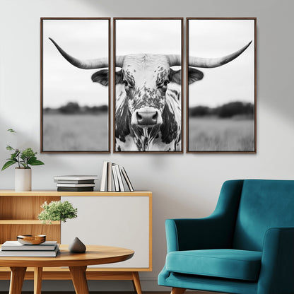 Capture the strength and elegance of nature with this striking black and white portrait of a longhorn cow. Its powerful presence makes a bold statement in any room.