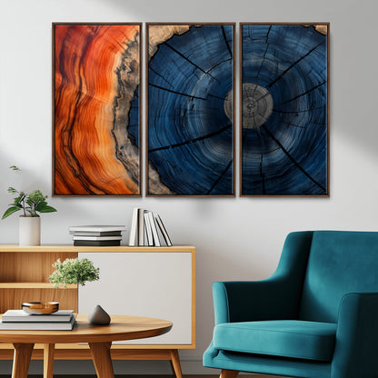 A captivating close-up of a tree trunk, showcasing its concentric rings in rich shades of blue, orange, and brown, highlighting the organic patterns of natural wood.
