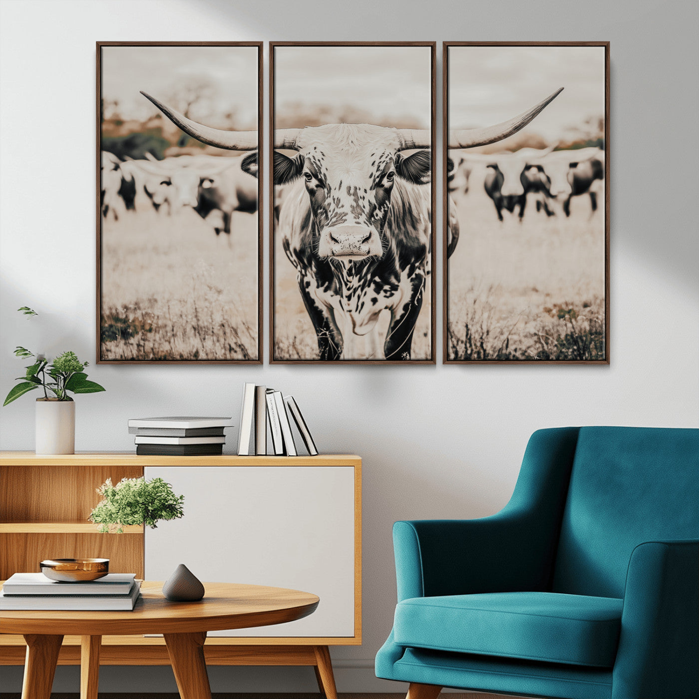 Canvas of a speckled Texas longhorn standing boldly in a field with a herd behind, perfect for rustic western or farmhouse wall decor.