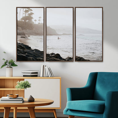 Framed canvas of a surfer in misty coastal tones at a foggy California beach, ideal for minimalist coastal beach or serene ocean-themed decor.