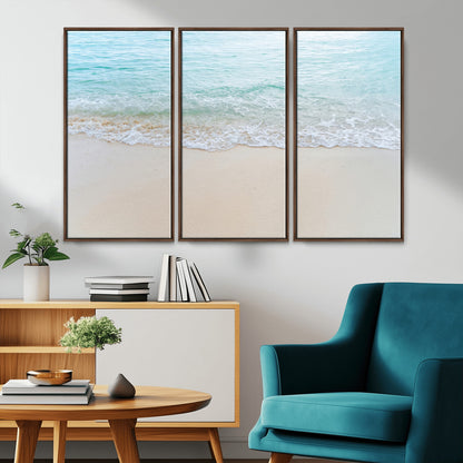 Soft shoreline with gentle aqua waves on smooth sand, ideal for minimalist coastal or pastel ocean-inspired home wall decor.