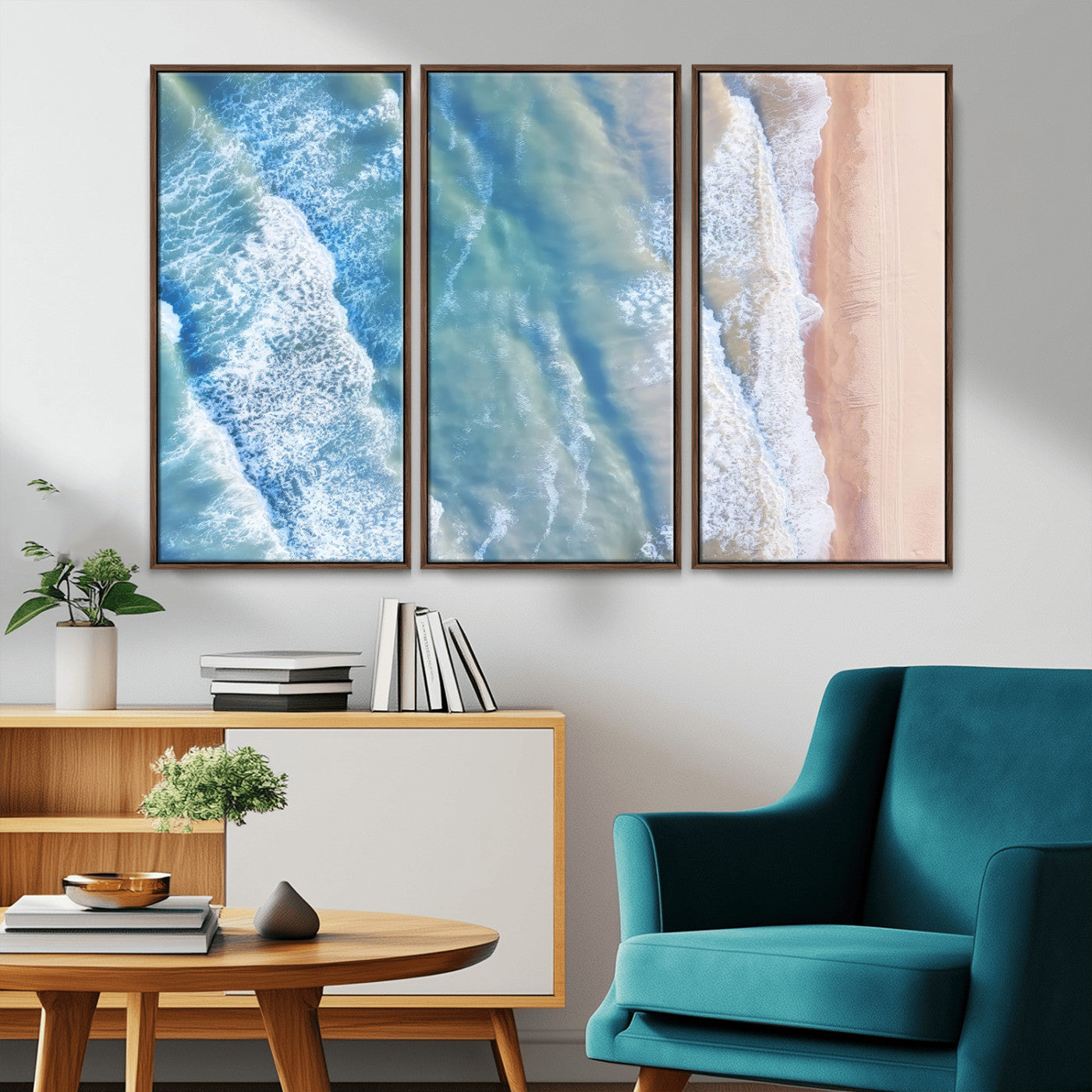 Aerial photo of soft blue waves meeting sandy shore, perfect for modern coastal or beach-themed decor with a light and tranquil aesthetic.