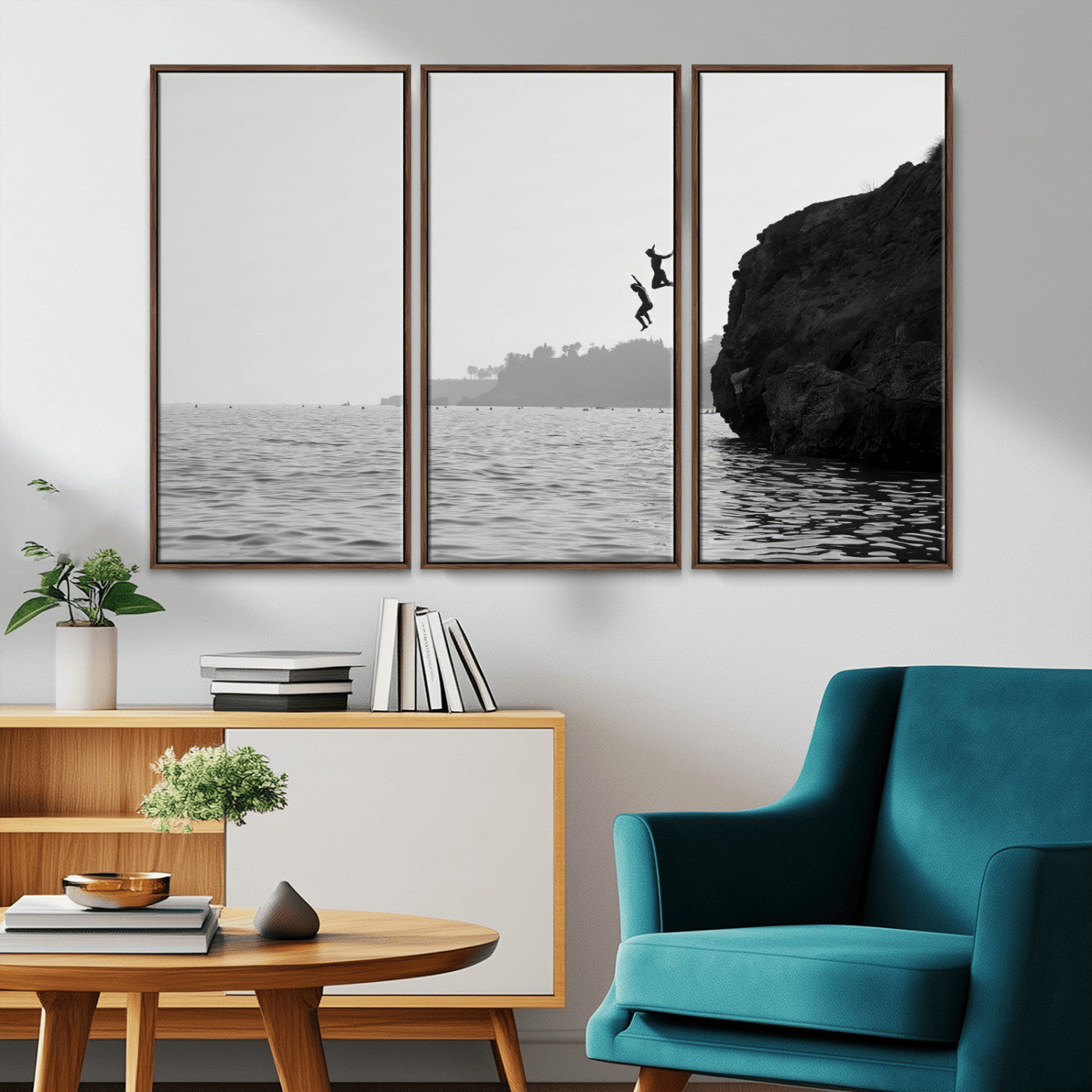 Black and white canvas of two figures cliff jumping into the sea, captured with moody tones, ideal for modern coastal or adventure-themed home decor.   2/2