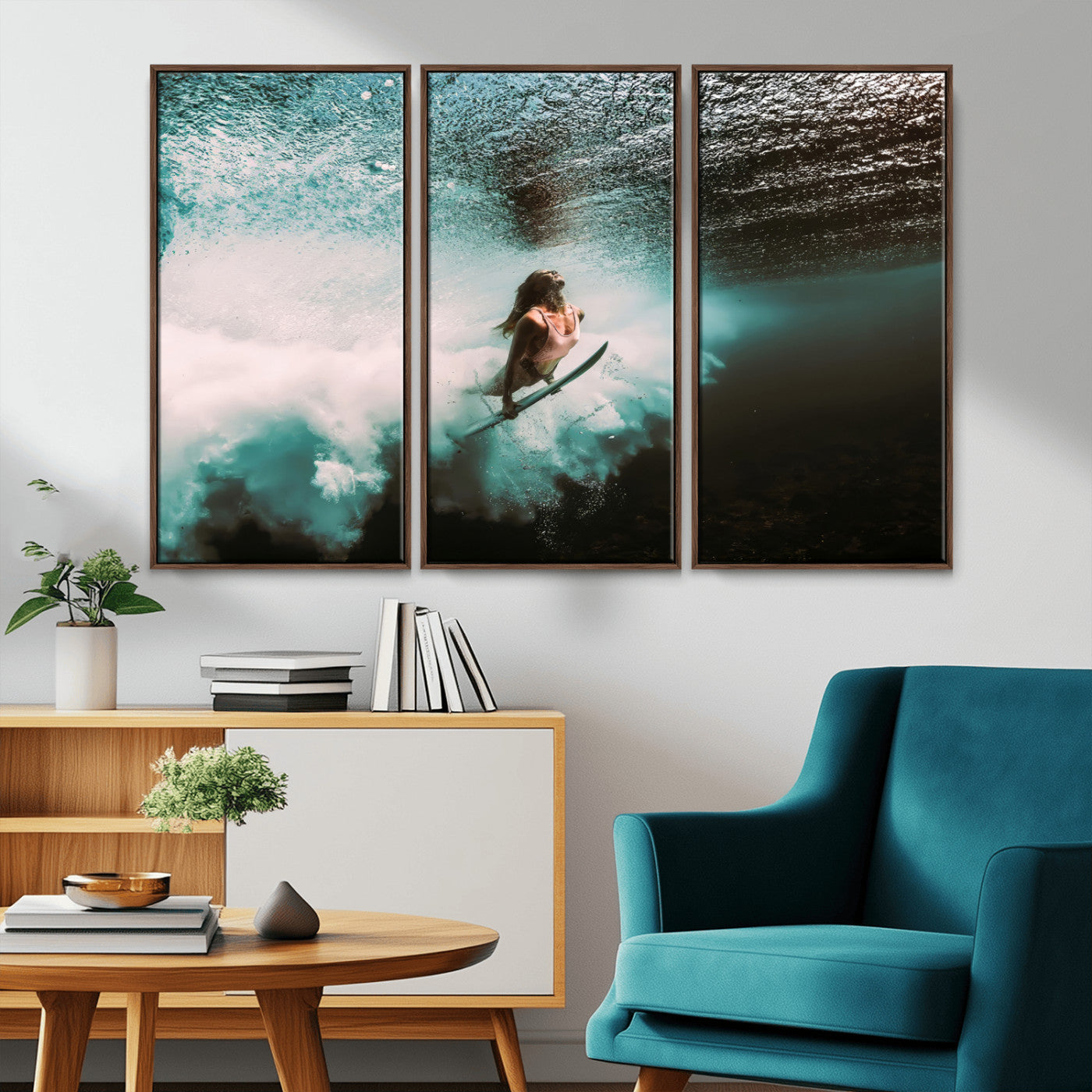 Vibrant underwater photo of a female surfer diving through turquoise waves, perfect for coastal boho or surf-inspired home decor.