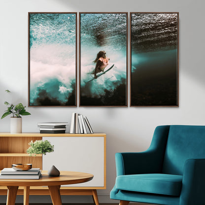 Vibrant underwater photo of a female surfer diving through turquoise waves, perfect for coastal boho or surf-inspired home decor.