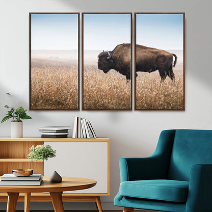A majestic bison standing in an open prairie field, its strong form blending into the golden grass under a vast blue sky, evoking the wild spirit of the American plains.