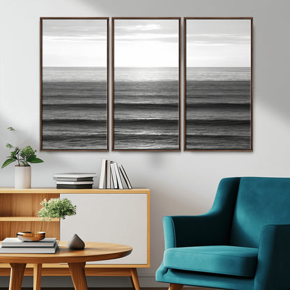 Minimalist black and white ocean view with layered waves reflecting sunlight, evoking a sense of calm and coastal serenity.