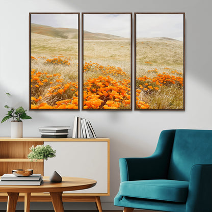 A golden field with vibrant orange poppies blooming across rolling hills under a soft, sunlit sky, creating a warm and rustic landscape.