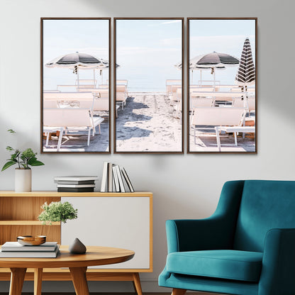 A serene minimalist beach scene featuring striped umbrellas, soft pastel sand, and an elegant lounge setup, creating a tranquil and stylish coastal retreat.