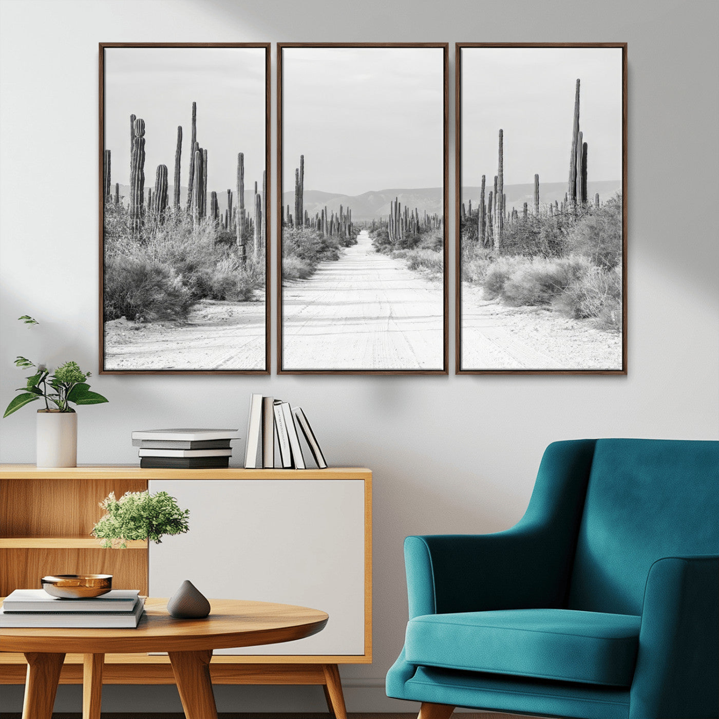 A black and white desert road stretching through a cactus-filled landscape, creating a rugged and timeless southwestern aesthetic with a sense of adventure.