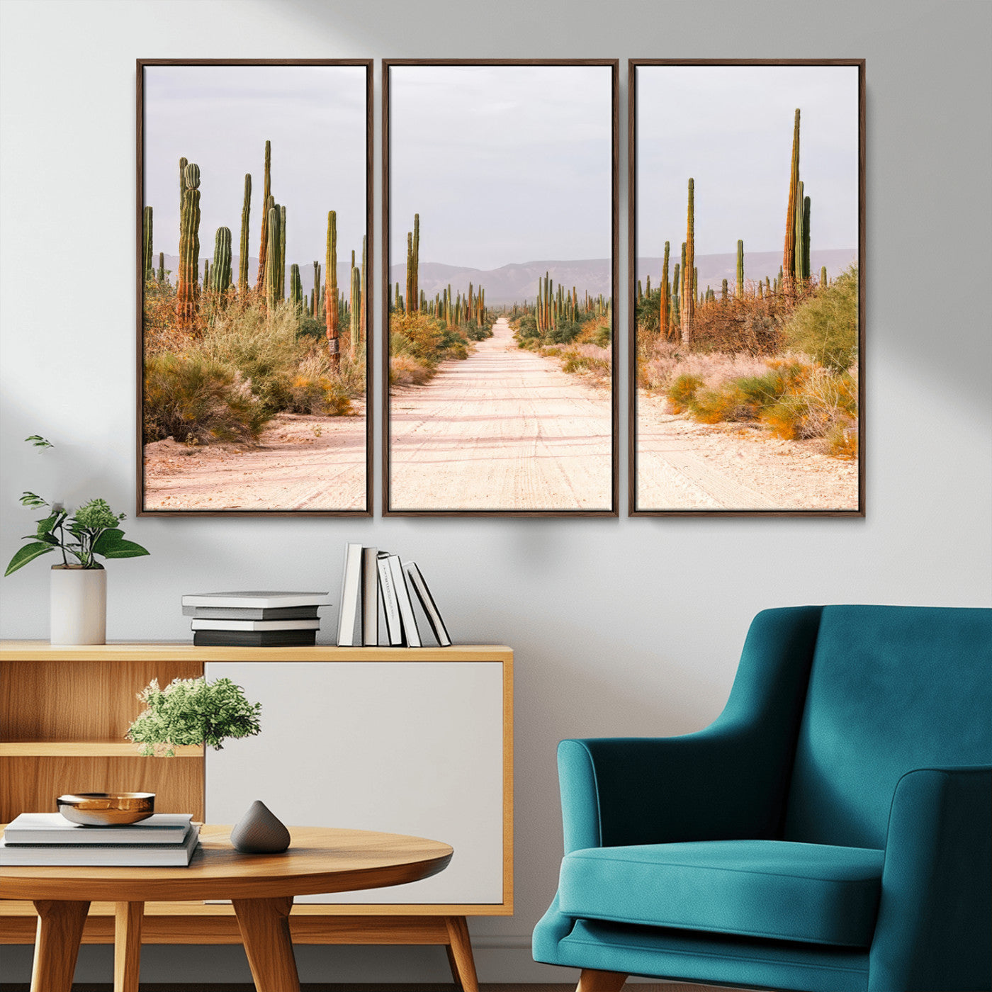 A desert road lined with saguaro cacti under a golden sky, creating a warm southwestern feel, perfect for boho or rustic decor.