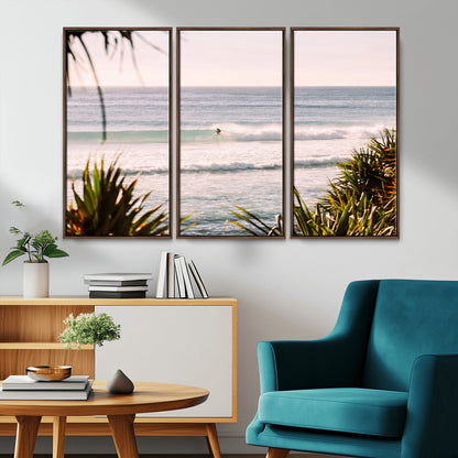 Canvas of a lone surfer riding a pastel wave at sunrise, perfect for tropical or coastal-themed spaces with a relaxed, airy vibe.