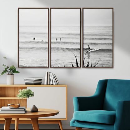 Monochrome canvas of surfers on calm ocean waves, ideal for minimalist coastal or beach-inspired interior decor.